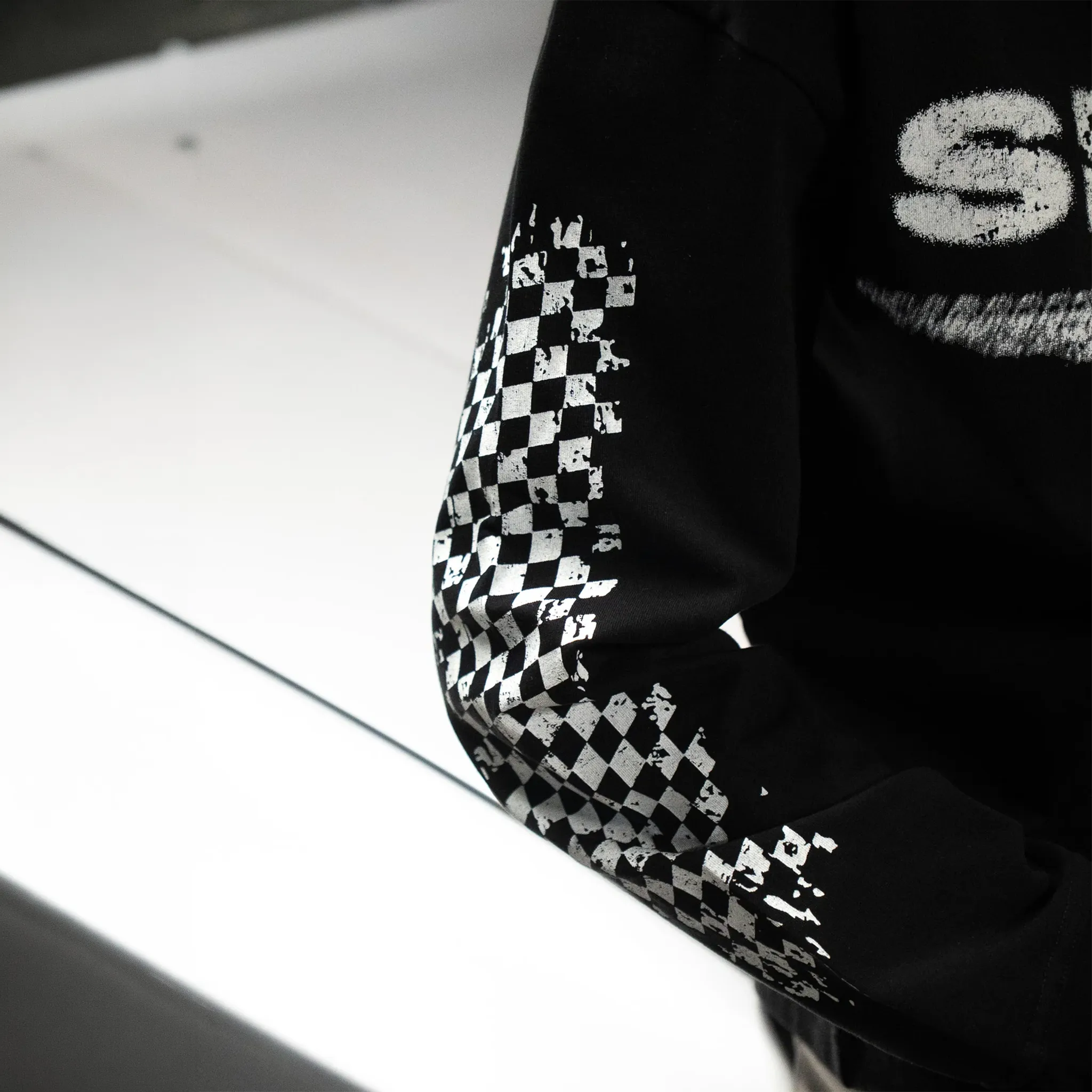 Detailed Sleeve View of SIARR Chequered L/S Black T-Shirt