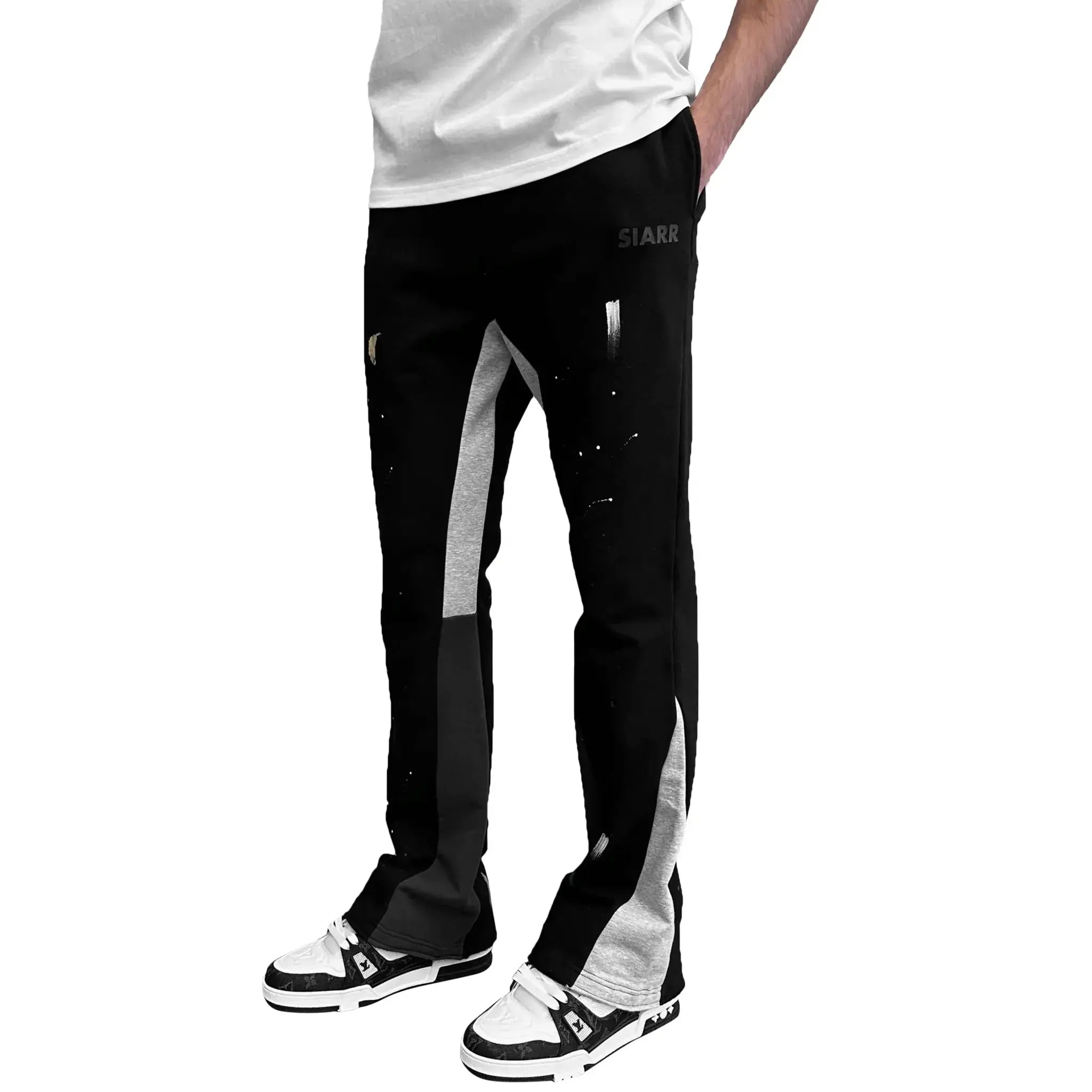 Model side view of SIARR Flared Joggers Black Paint