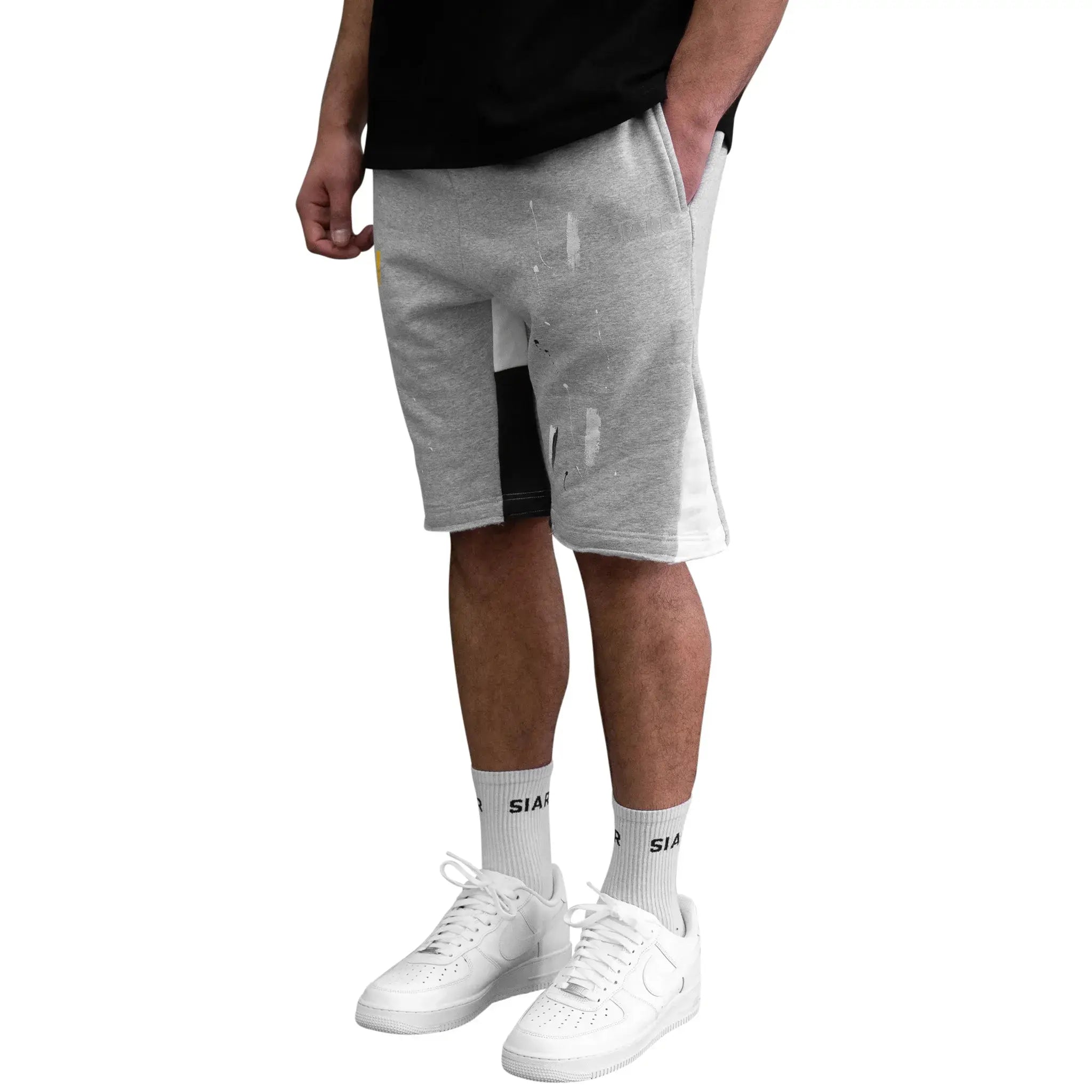 Model side view of SIARR Paint Shorts Grey