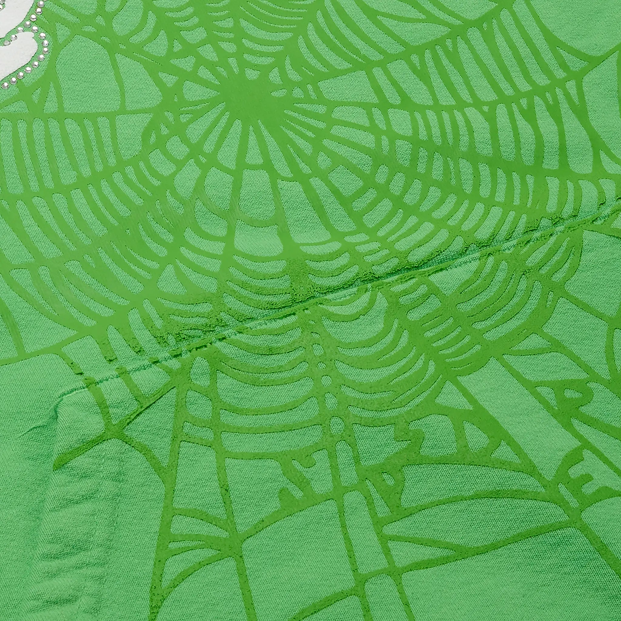 Detail view of Sp5der Web Slime Green Hoodie