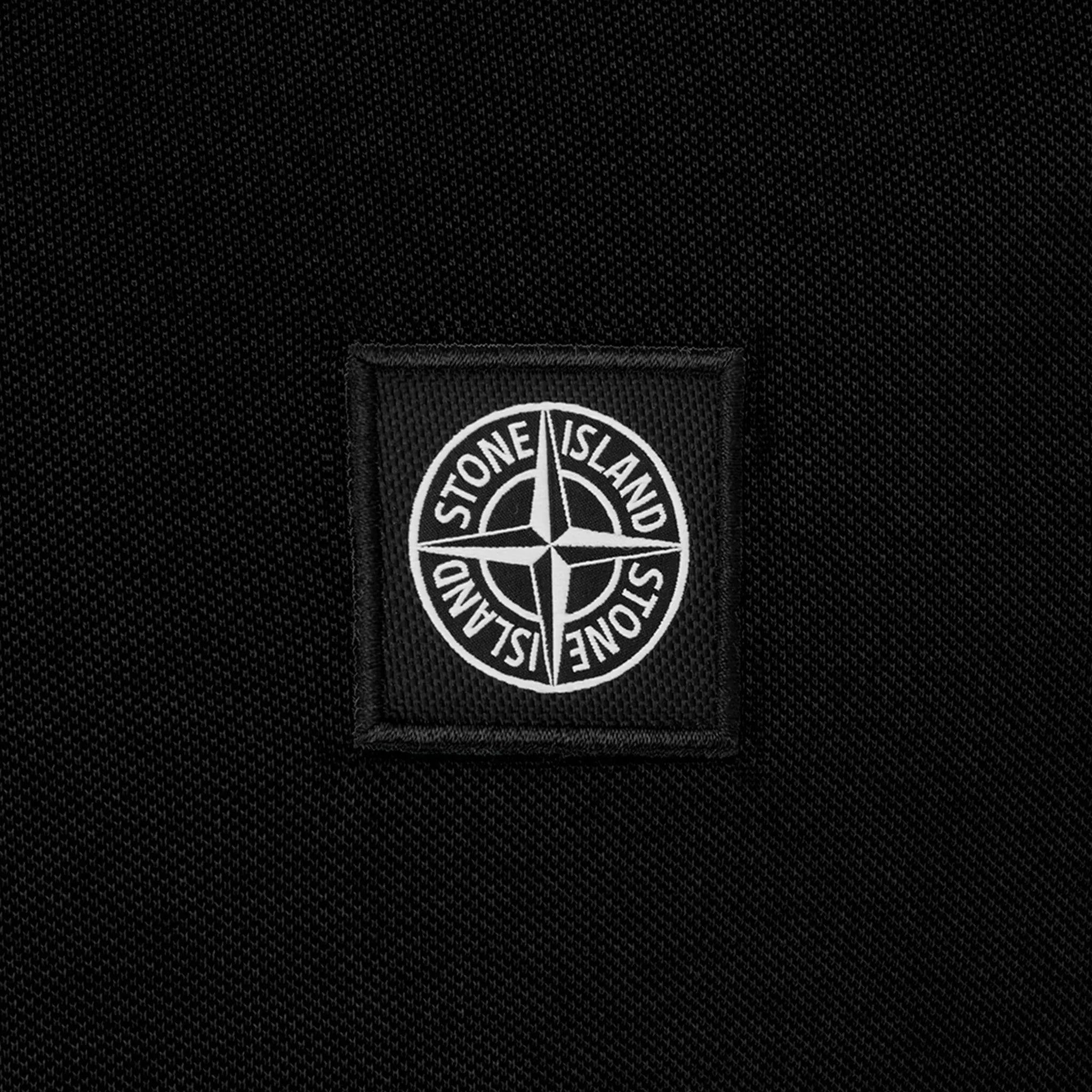 Detail view of Stone Island Tipped Badge Logo Black Polo Shirt 10152sc18-a0029