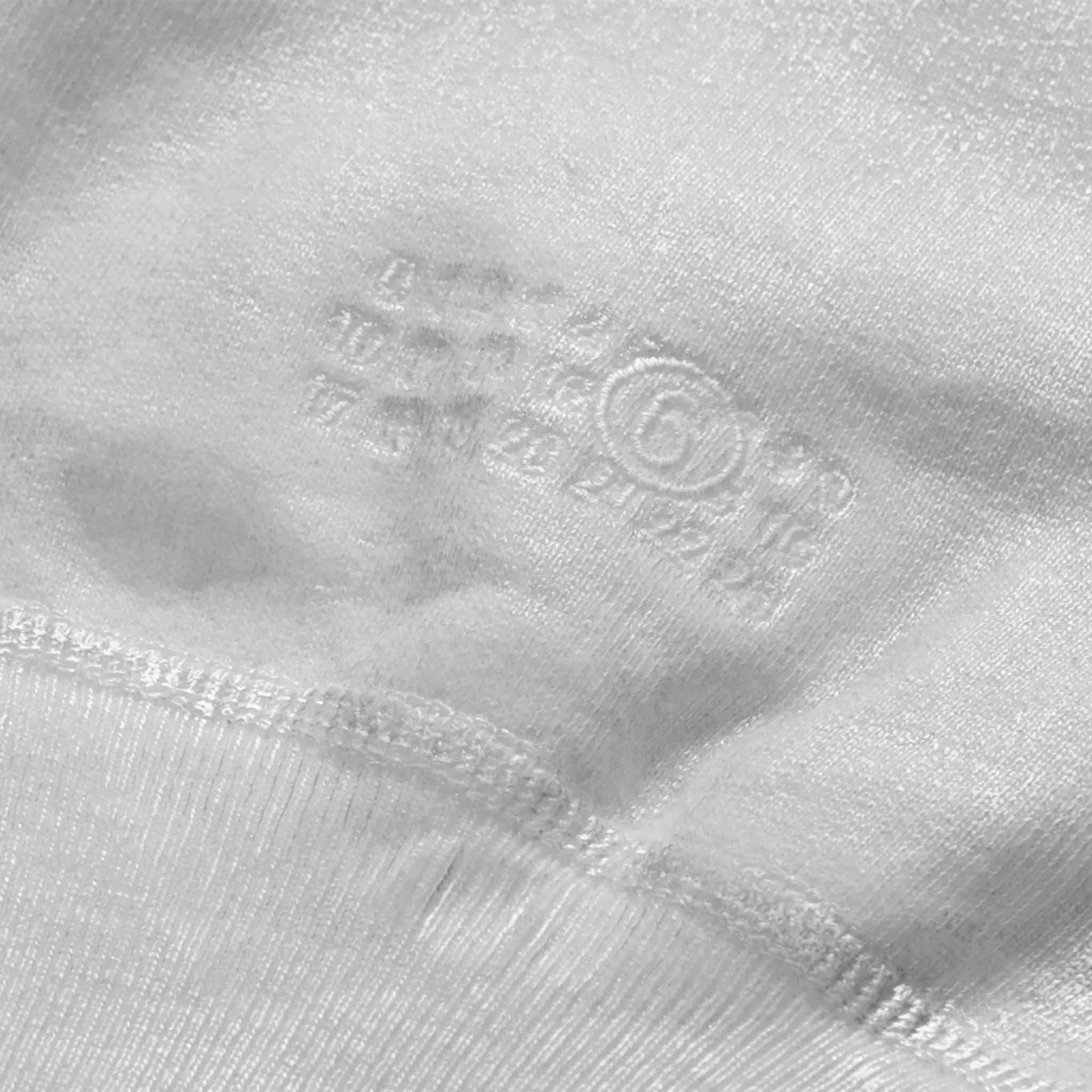 Detail view of Supreme x MM6 Maison Margiela Foil Box Logo White Hoodie