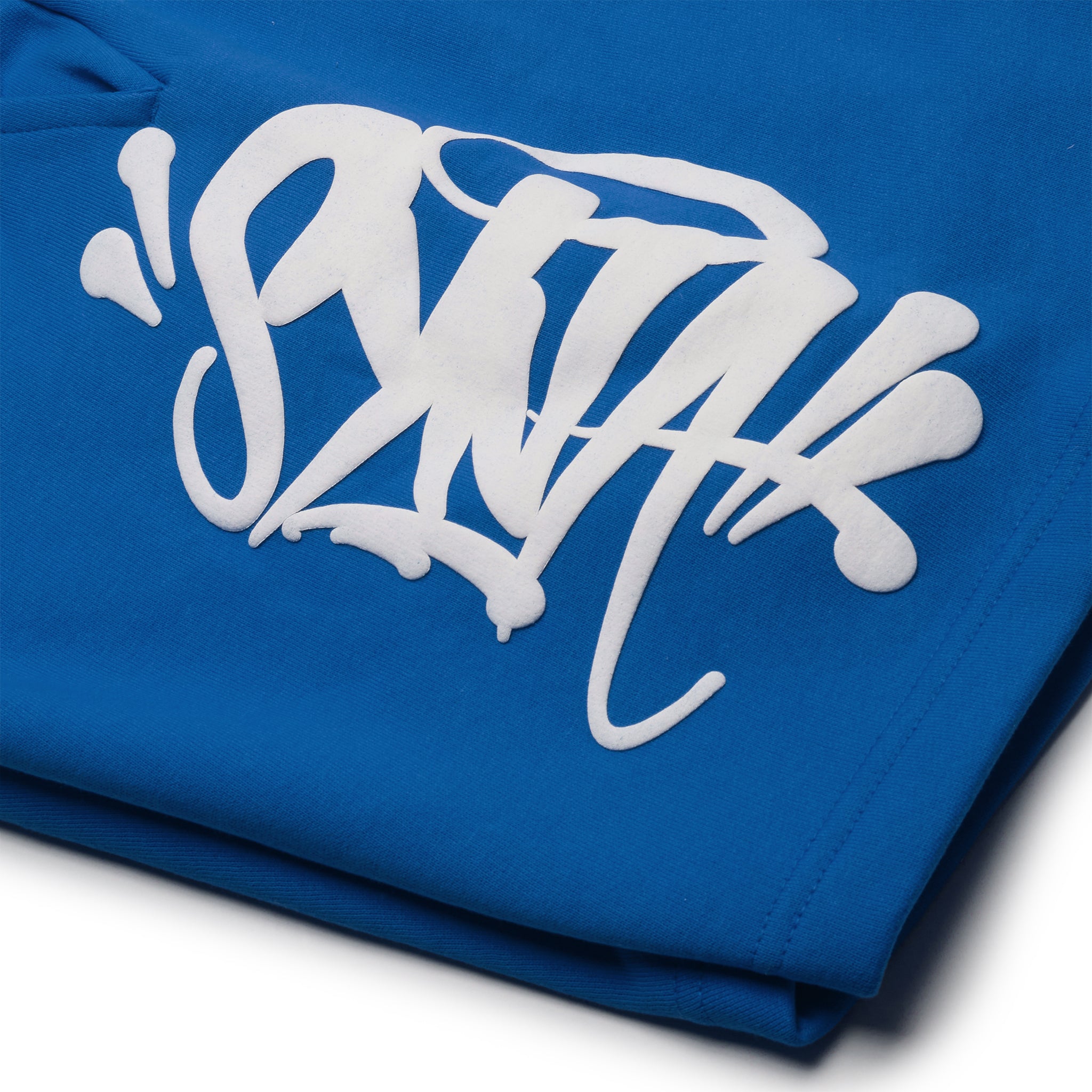 Logo view of Syna World Team Syna Twinset Blue T-Shirt & Shorts TEAMSYNA-SHT-BLUE