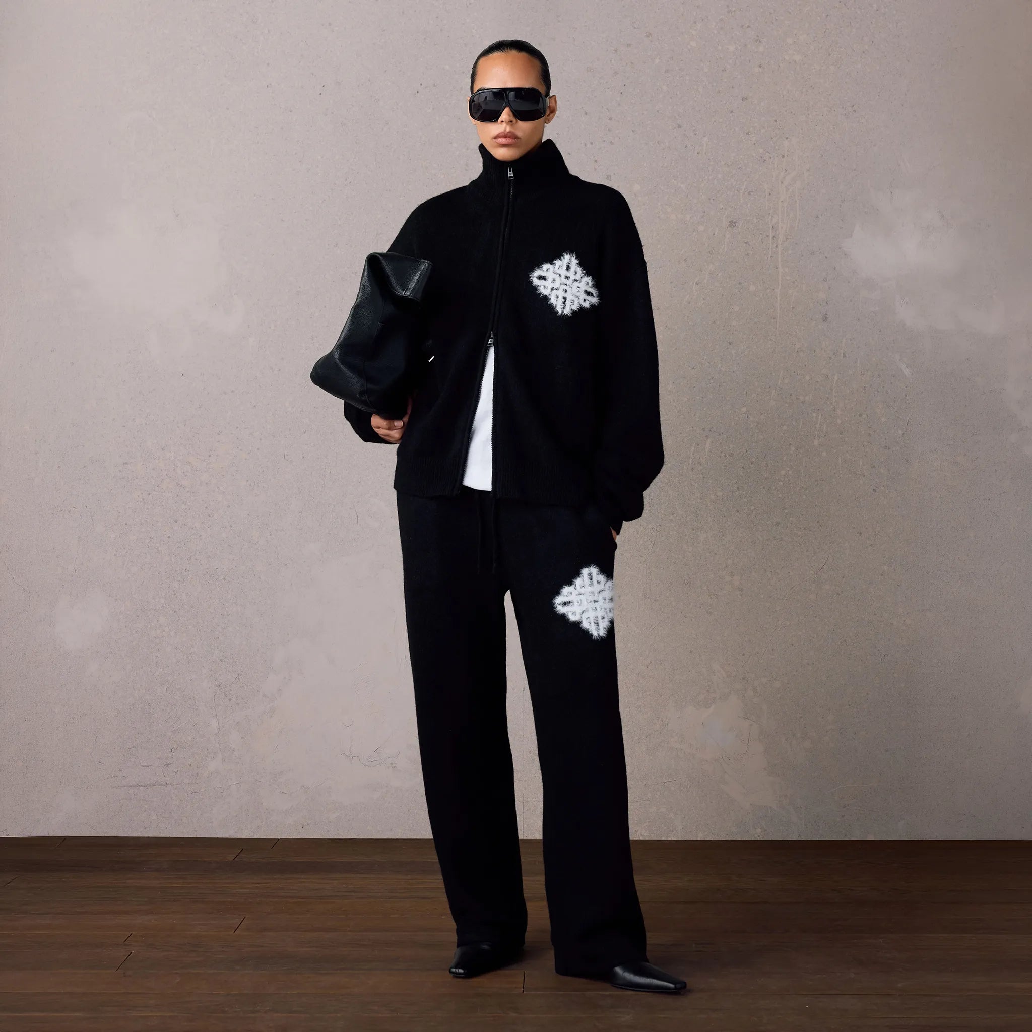 Front View of The Couture Club Emblem Fluffy Knit Black Sweatpants