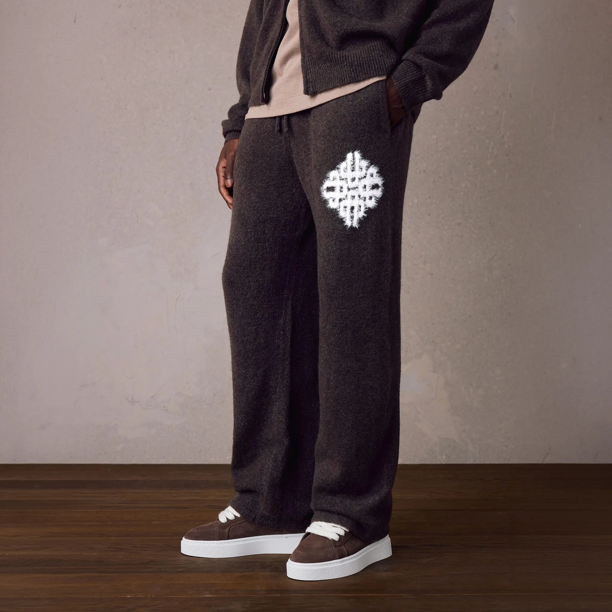 Front View of The Couture Club Emblem Fluffy Knit Brown Sweatpants