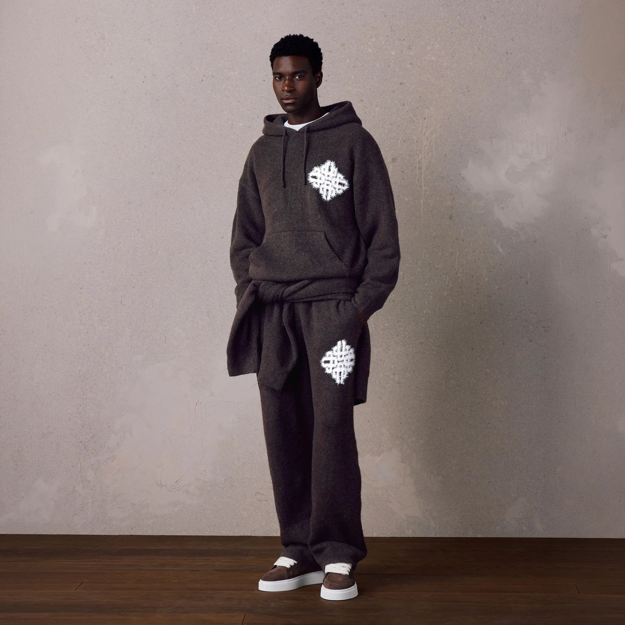 Front View of The Couture Club Emblem Fluffy Knit Brown Sweatpants