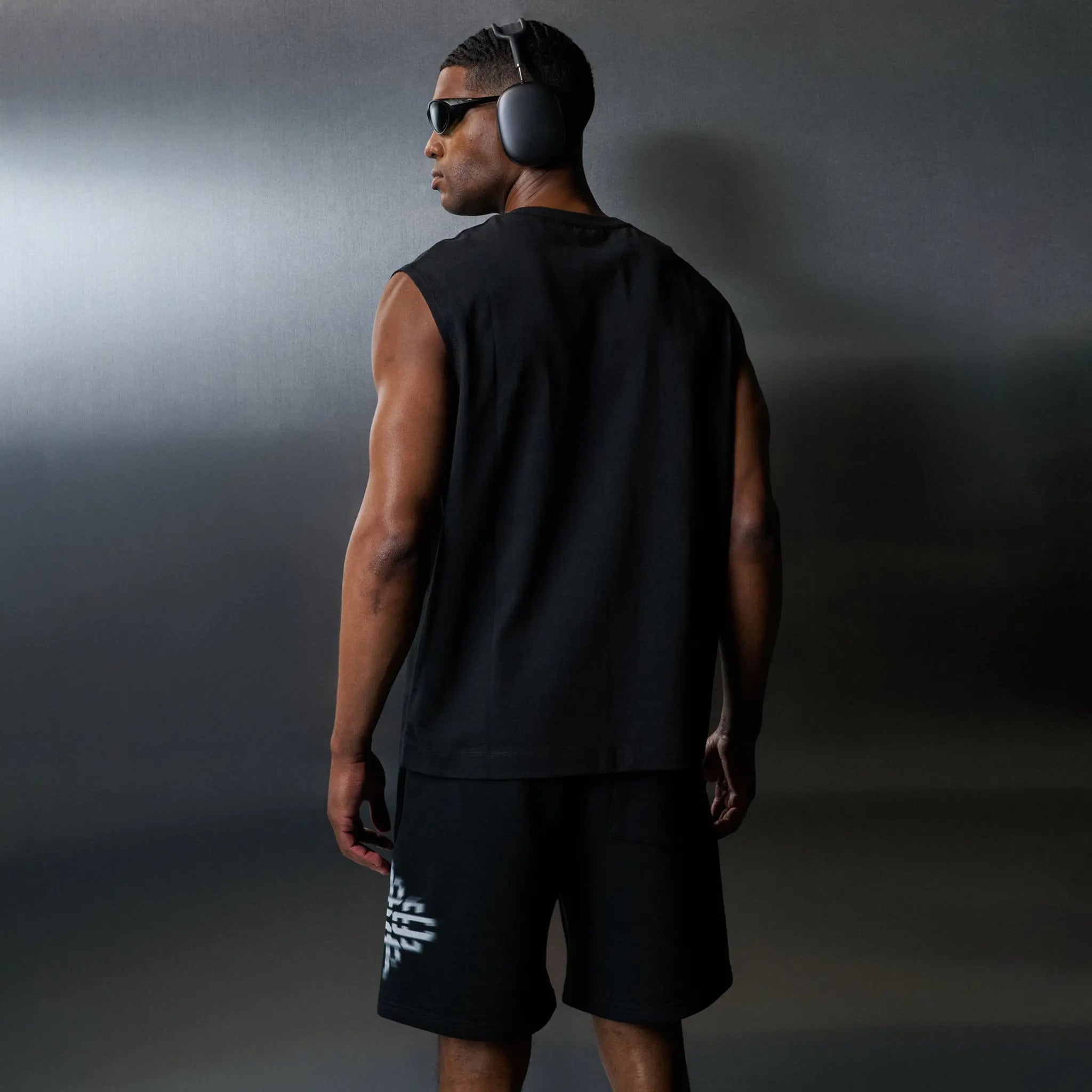 Back Side View of The Couture Club Luxury In Motion Emblem Black Vest