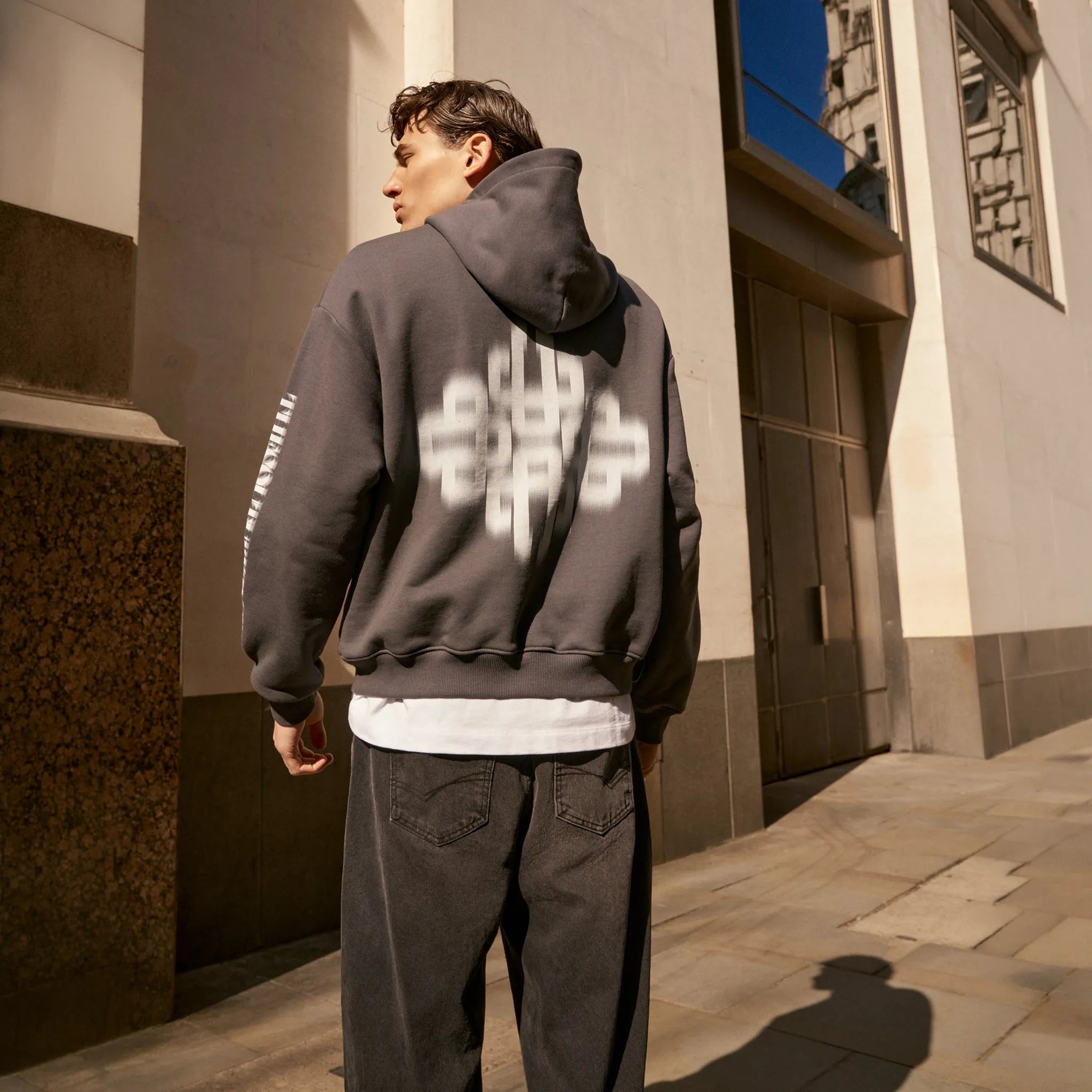 Back View of the couture club motion blurred emblem charcoal hoodie tccm2978