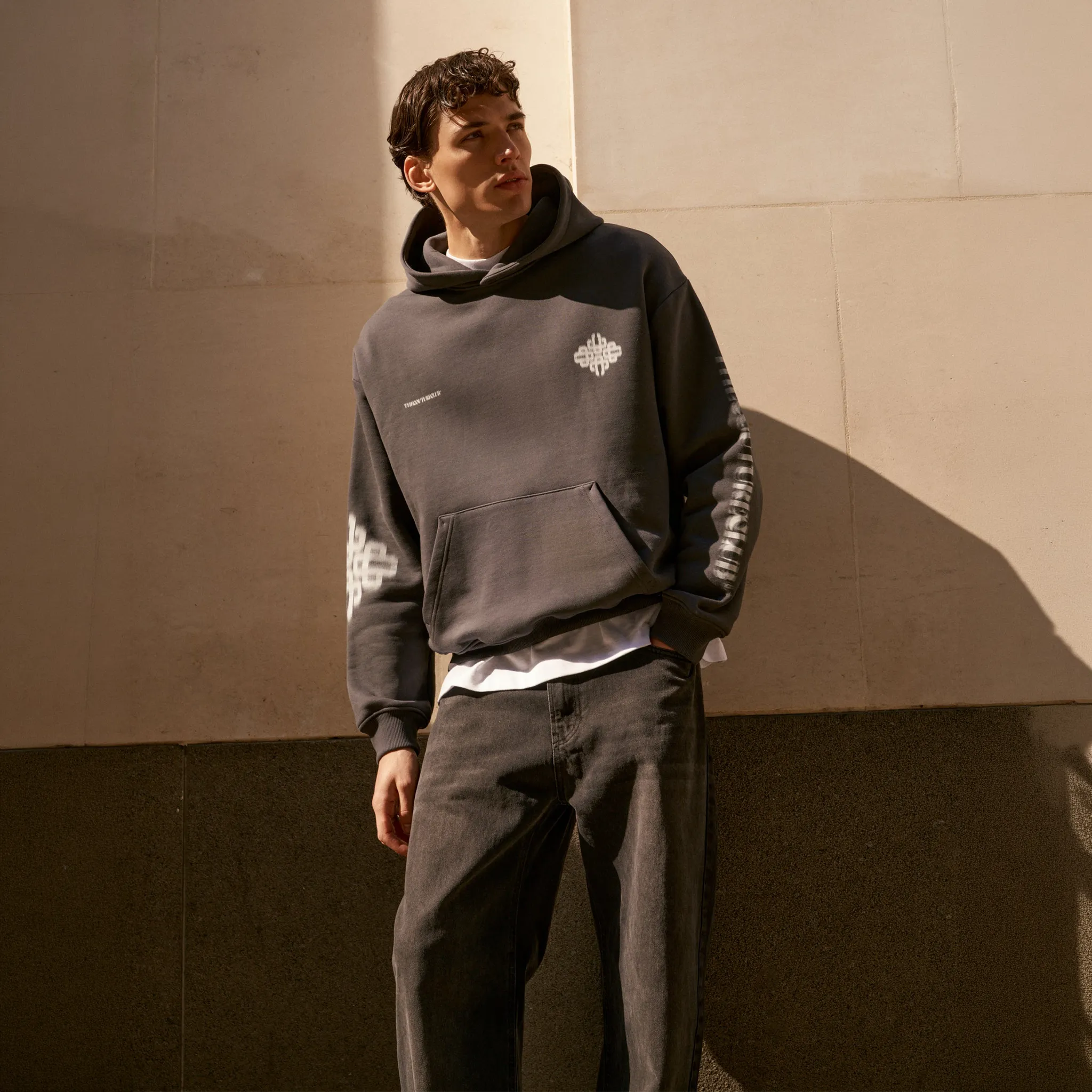 Detailed Front View of the couture club motion blurred emblem charcoal hoodie tccm2978