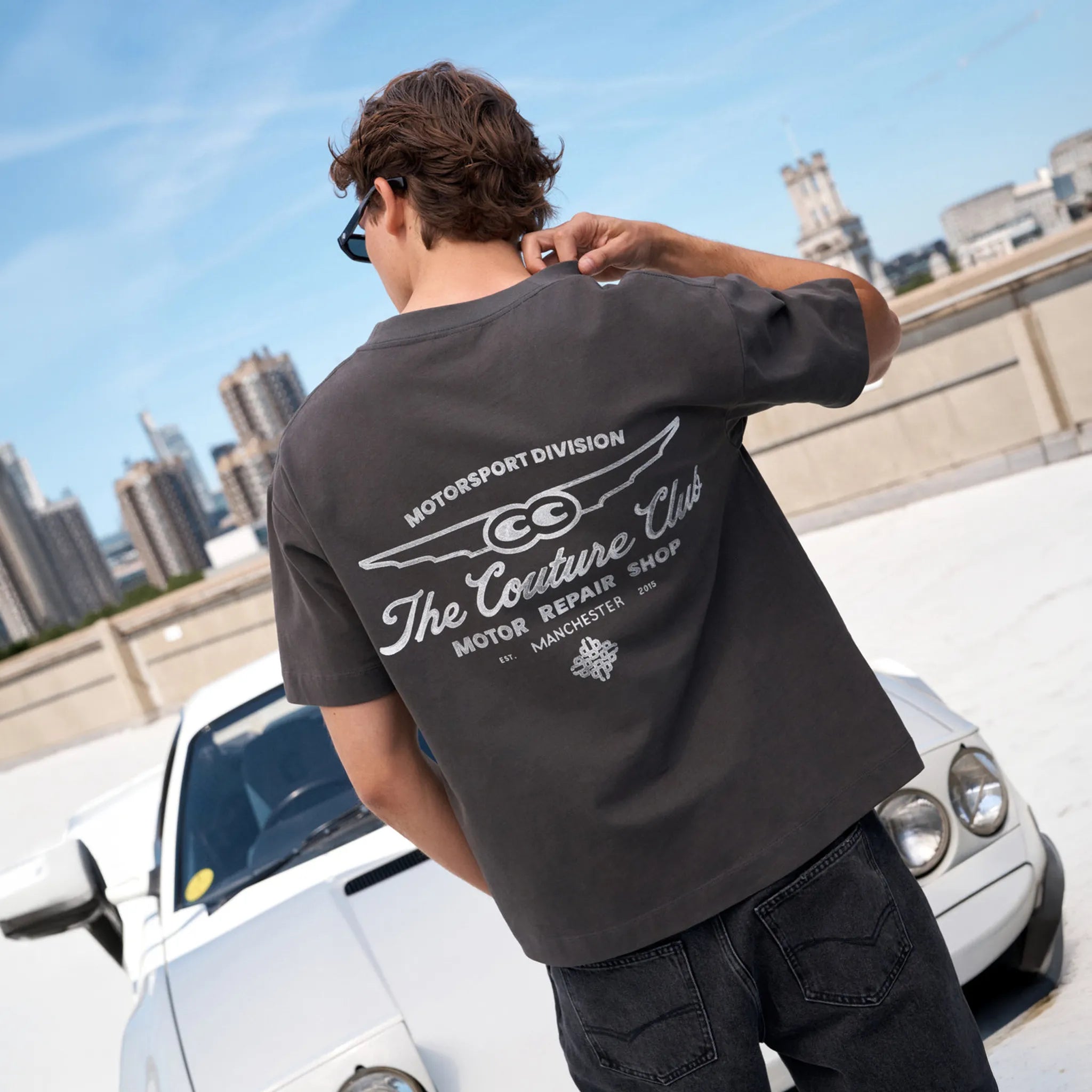 Back View of The Couture Club Motor Repair Shop Graphic Charcoal White T-Shirt