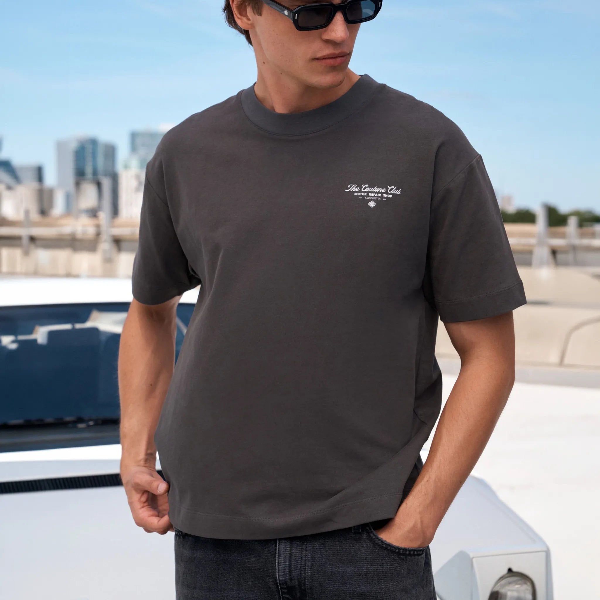 Front View of The Couture Club Motor Repair Shop Graphic Charcoal White T-Shirt