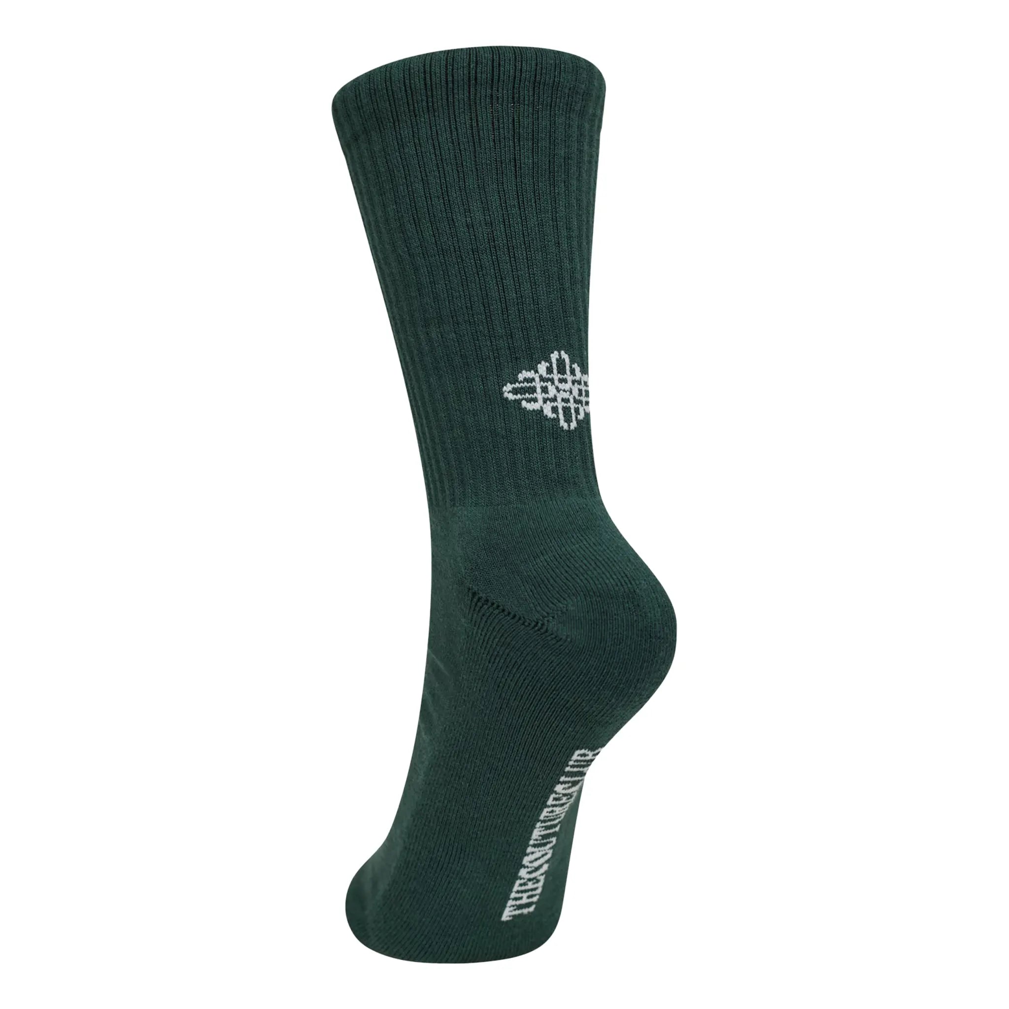 Back Side View of The Couture Club Reverse Emblem Copyright Green Socks
