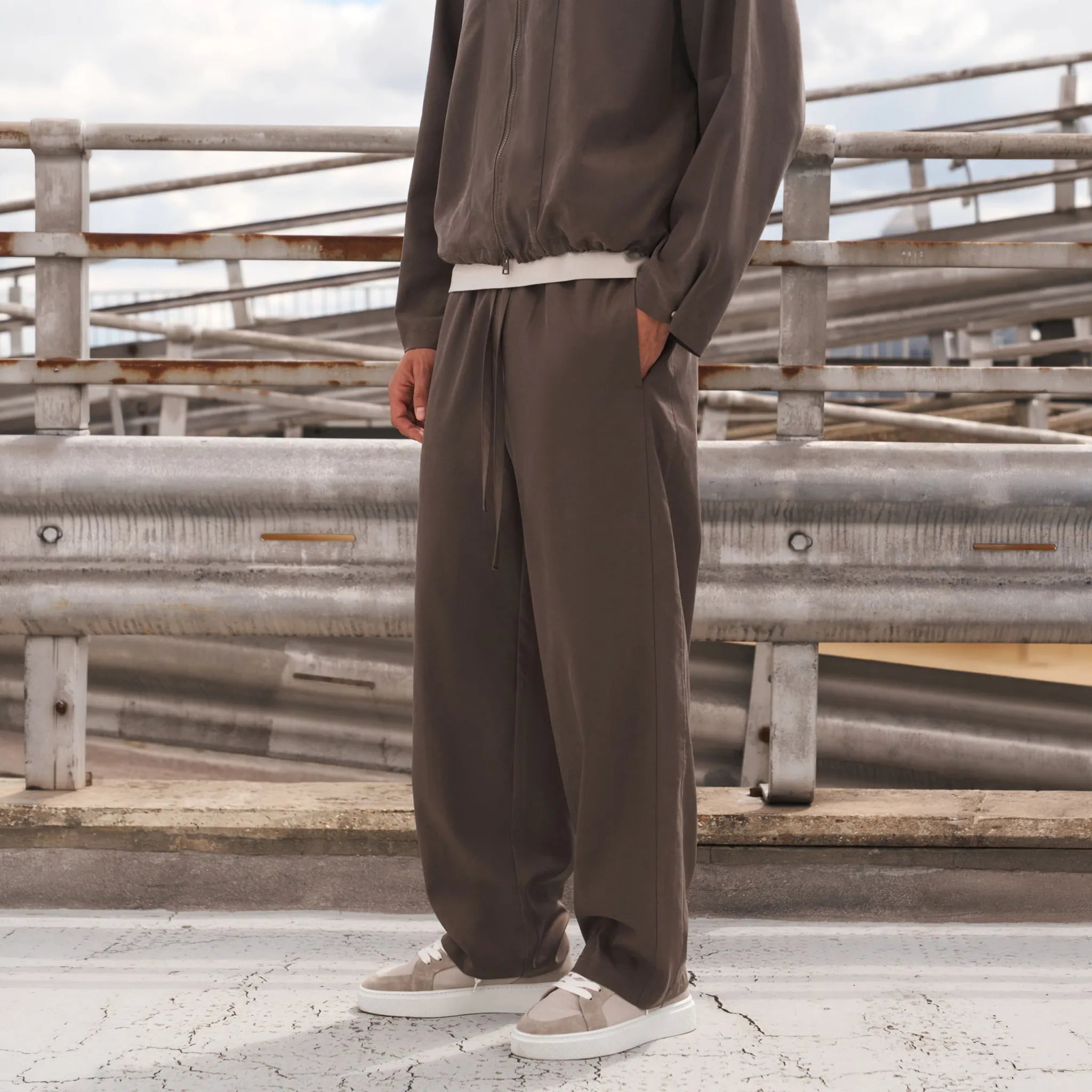 Front Side View of The Couture Cupro Panelled Brown Trousers