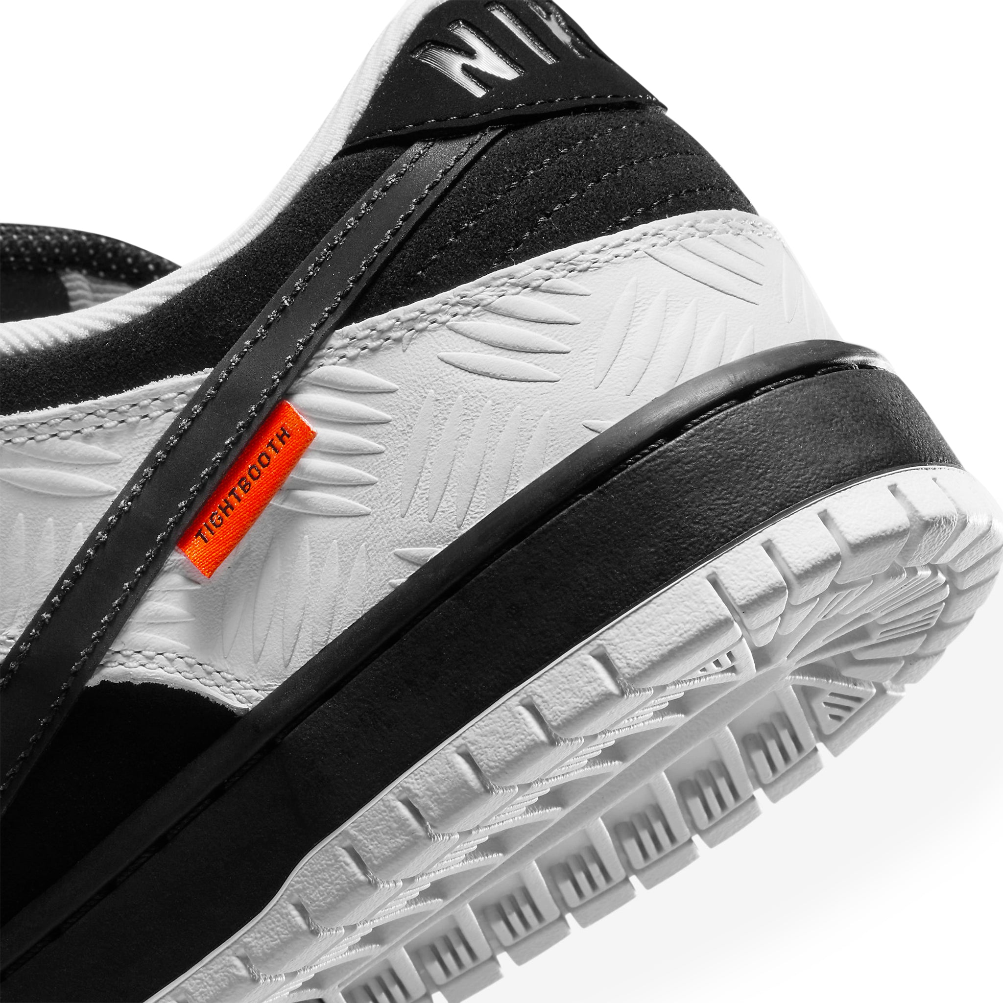 Heel view of Tightbooth X Nike SB Dunk Low Black White FD2629-100