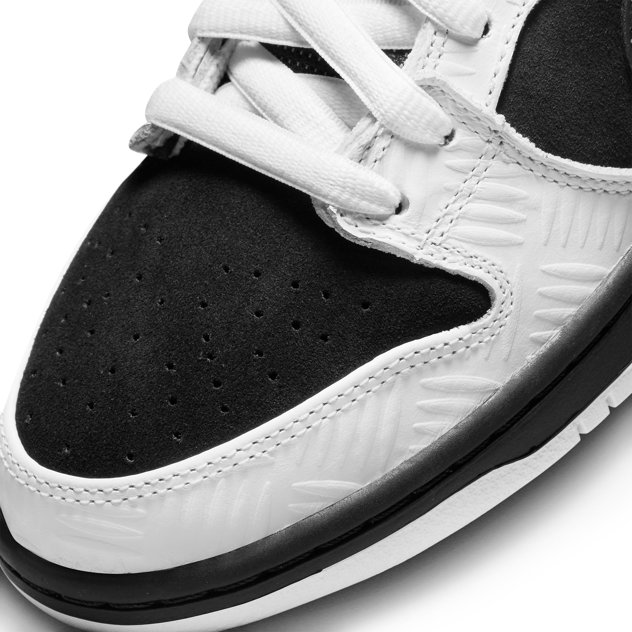Toe box side view of Tightbooth X Nike SB Dunk Low Black White FD2629-100