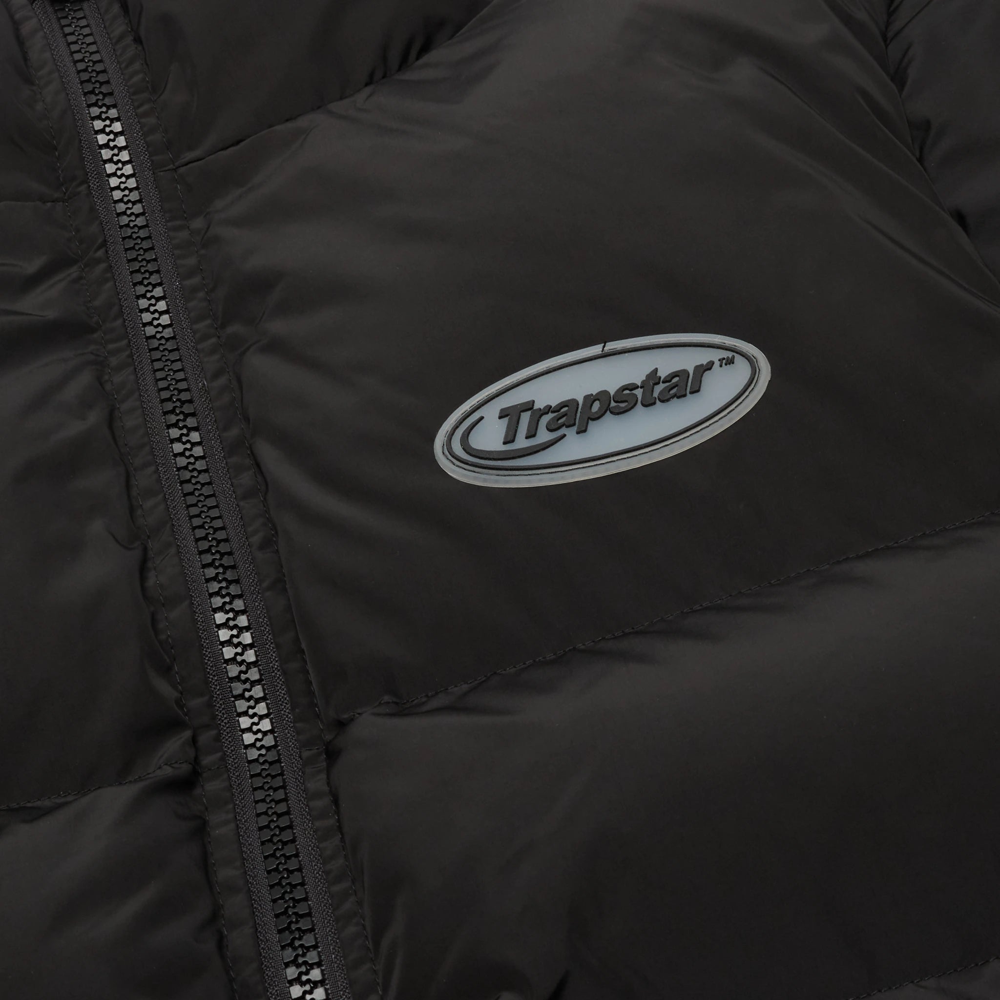 Front logo view of Trapstar Hyperdrive Black White Puffer Jacket