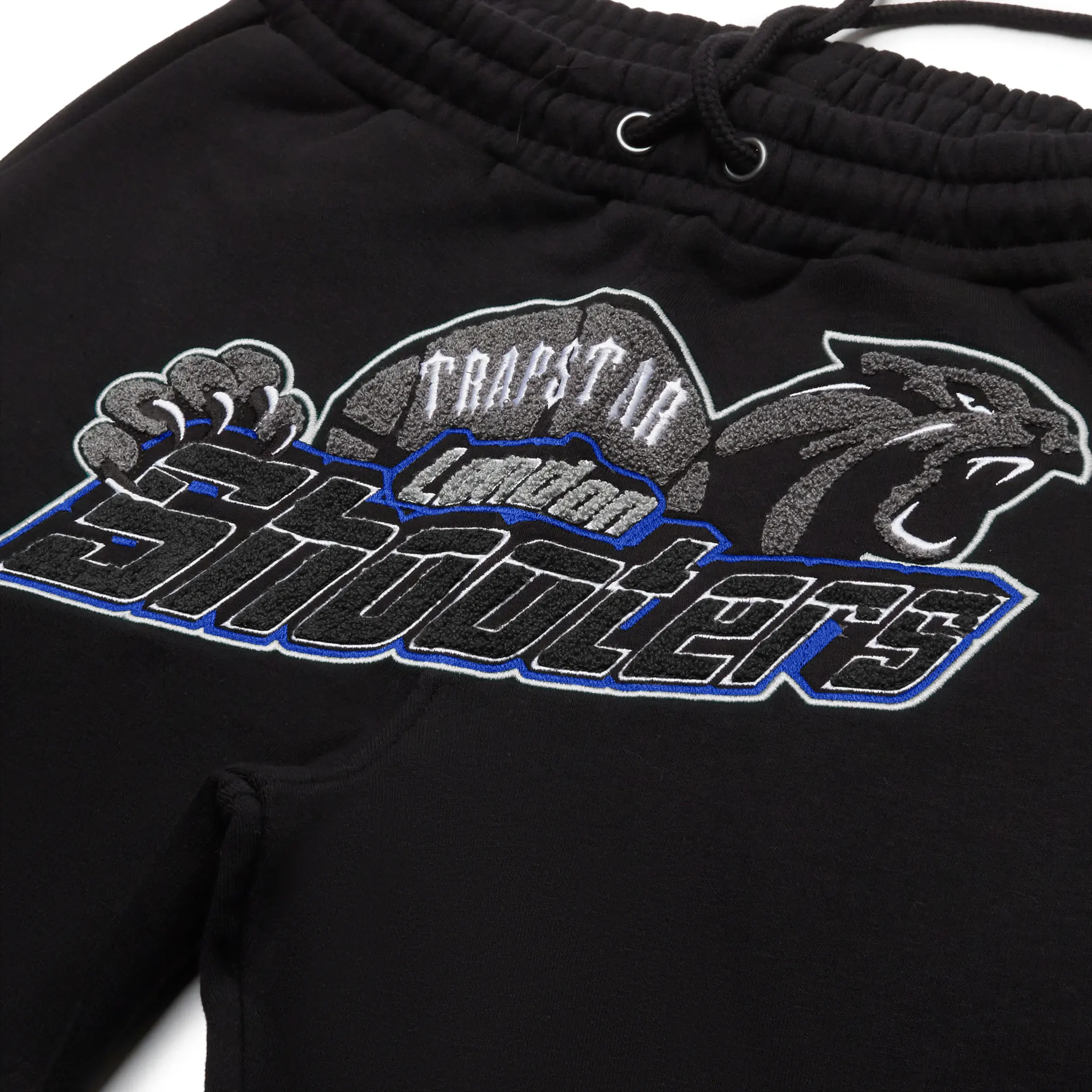 Pants logo view of Trapstar Shooters Black Blue Tracksuit